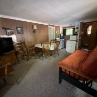 cabin-4-view-of-dining-area-and-futon-and-tv